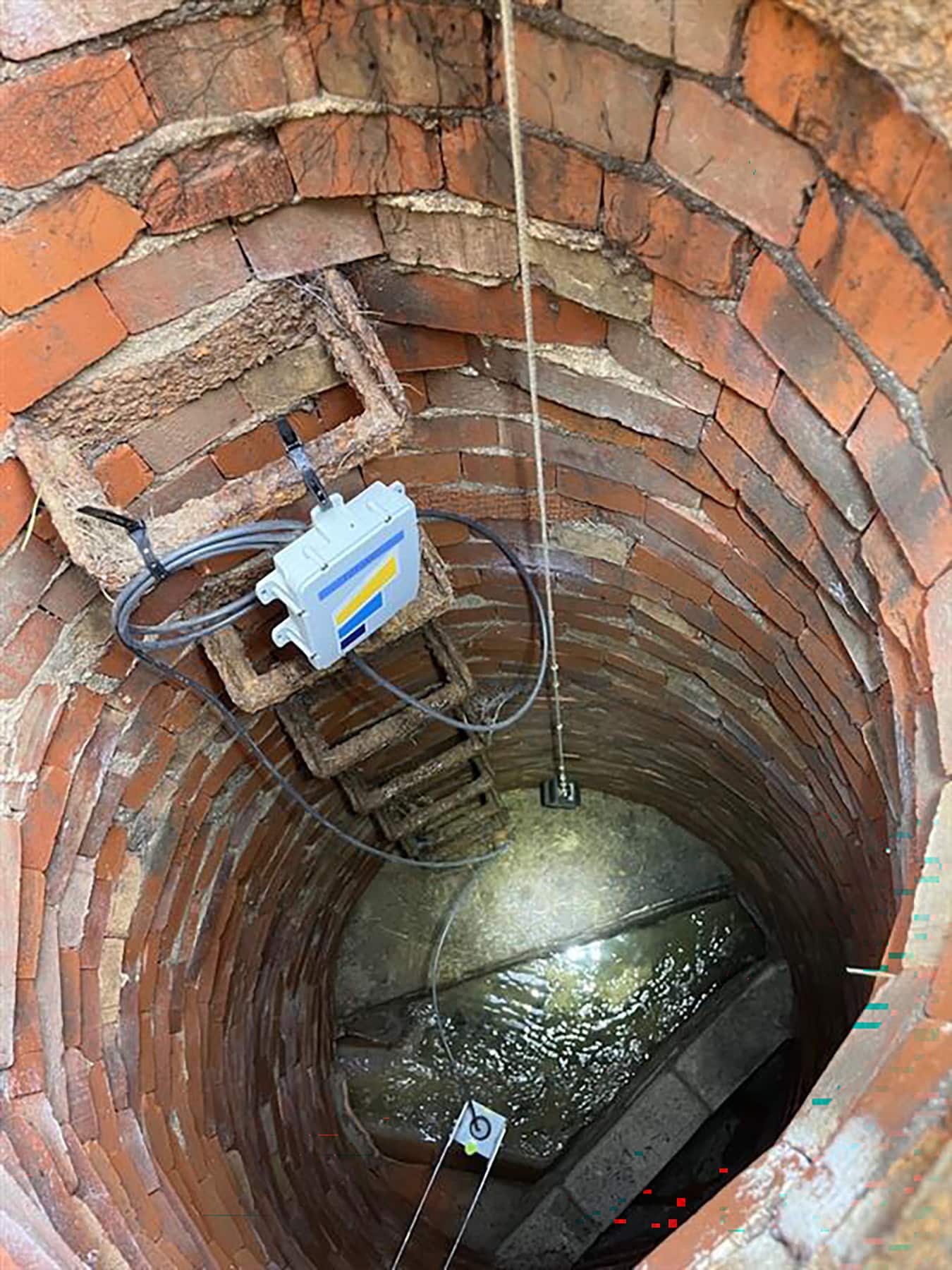 Smart sensor placed on ladder in sewer